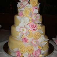 Wedding Cake Yellow cake with Banana filling, sugar flowers made from fondant