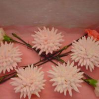 Flower Cupcakes These were for an adult birthday. Pulled Star cupcakes in pink and white with some pink and white carnations.