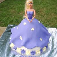 Doll Cake The picture makes it look blue, but it is purple. Chocolate cake covered in MMF, with MMF accents.