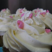 Strawberries & Cream For Valentine's Day French vanilla cupcakes, strawberry & cream filling, vanilla buttercream, tiny candy hearts