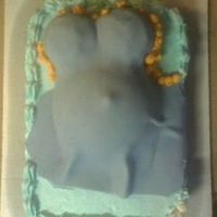 Baby Shower Cake this is my first order. its a belly cake. the base cake is double fudge with a banana split filling. with blue buttercream and buttercream...