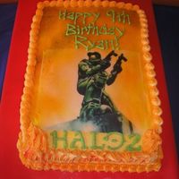 Halo Cake Requested by my 9 year old son! This is a 1/4 sheet cake, 1/2 chocolate, 1/2 vanilla, buttercream icing. Master Chief is an edible image.