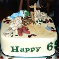 65Th Birthday Cake Fruit cake, fondant icing, all items made in fondant.Made for my Godfather who was about to go on a world tour & has a great love of...