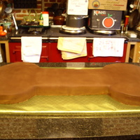 Dog Bone Cake Cake shape to be a dog bone, covered in chocolate flavoured fondant. Actually six cakes altogether!