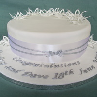 White & Silver Flower Wedding Cake My brief was for a white & silver cake, simple but elegant. Made with Madeira cake, covered in fondant with fondant flowers.