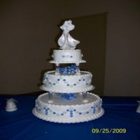 14, 10, 6 Wasc With Buttercream Icing Traditional cake with buttercream and royal icing flowers dusted with petal dust. I charged 175.00 for this cake and the grooms cake...