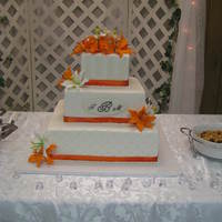 Square 3 Tier Wasc With Buttercream Icing This was for a coworkers daughter 14 10 6 inch cakes iced in buttercream with GP flowers purchased and fabric ribbon