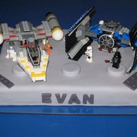 Star Wars Lego Birthday Cake I created this cake for my Lego-maniac son's birthday. It is a bostom cream cake covered with rolled fondant. I rolled fondant thicker...