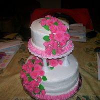 Wilton Course 3 I love this cake. The roses took time but were beautiful when they were done. first time doing a tier cake