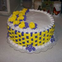 Mother's Day this round cake with buttercream frosting and royal icing pansys was done for my mother, sister and grandmother