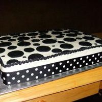 Black And White black and white polka dot cake - all BC with a ribbon around the bottom.