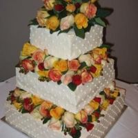Square Wedding Cake With Real Flowers This was my first wedding cake. I used floral foam between the layers to hold the flowers in place. The rest of the cake was decorated in...