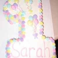 First Birthday This cake was sculpted from a quarter sheet cake with almost no wasted cake. Decorations are buttercream.