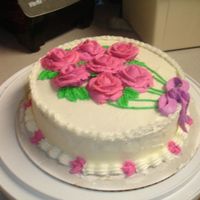 Wilton Course 1 Rose Cake My roses were too big, so the bow didn't fit and i couldn't write anything on it...oh well, maybe better next time.