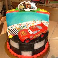 Cars Stage Cake This cake is a stage cake. It consists of a double 8 inch and the stage part is one 8 inch cut in half and stacked on one another. It only...