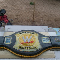 Wwe Championship Belt this a cake shaped like a WWE championship wrestling belt for a friends sons and they loved it so much they didn't want to cut it and...