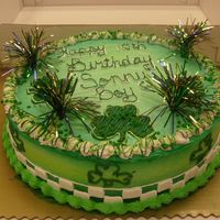 St. Patrick's Day Cake This is a 14 inch double layer cake. It just has St. Patrick's Day decorations and the customer just wanted everything green! so this...
