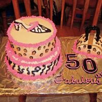 Fabulous 50 Vanilla cake iced in buttercream. Shoe is made of fondat.