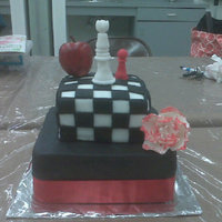 Twilight Chocolate cake covered in fondant. Fondant decorations, chess pieces. Apple was made of wood, didnt have time to make that in fondant.