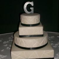 First Wedding Cake! The bride saw a picture online of a cake that looked like tile and that is what she wanted. The cake is covered in buttercream with...