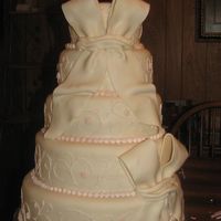 Img_1656.jpg The fondant bows were copied from a picture, I didn't care much for them but it was what the customer wanted