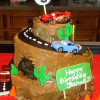 Cars Birthday Cake Cars Birthday Cake for a three year old boy. It's a marble cake with buttercream frosting and fondant accents. The road winds all the...