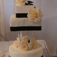 Cakes_012.jpg CSM. Another dummy cake for a bridal show. The ribbon is actually brown, but shows up dark in the picture.