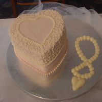 Cakes_011.jpg CSM. This idea was taken from Chef_Stef (she has some awesome cakes!). This was my giveaway cake for the bridal show. 6" vanilla cake...