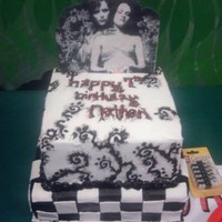 Twilight Birthday Cake this was a marbled (chocolate and vanilla) cake with buttercream icing. checker board bottom, spooky vines on top tier, and an edible photo...