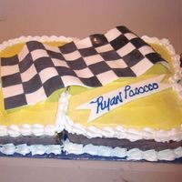 48 Cake The #'s 48 carved out of 2 sheet cakes and flag & banner is made out of fondant.