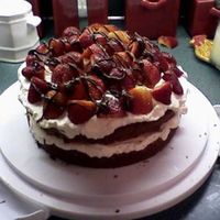 Strawberry Shortcake French Vanilla cake with Strawberries layered with Fresh Whip Cream and drizzled with Chocolate...