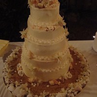 Seashell Cake 6,8,10,12,14 inch tiers, orange cake and strawberry cake with vanilla swiss buttercream. all the seashells on the cake are made out of...