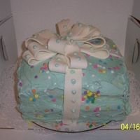 Gift Box Cake This is a 4 layer cake with a fondant bow. This is the 1st time I worked with fondant!