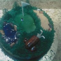 Golf Cake This is a cake I did for an eye doctor's birthday he loved golf so I mad the golf ball and eyeball.