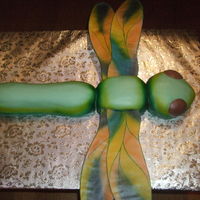 3D Dragonfly Red velvet cake with cream cheese icing covered with fondant. The wings are done in gumpaste. Thanks for looking!