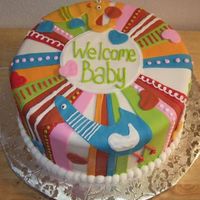 Baby Shower Cake White cake with buttercream icing covered in fondant to replicate the diaper bag.