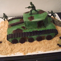 Army Tank Cake Army Tank cake for my hubby who turned 40 and is a veteran of the Gulf War. He was ecstatic when I finished the cake!