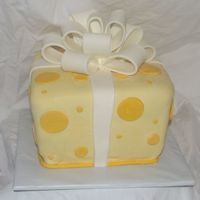 Yellow Whimsy Gift This is an all fondant yellow giftbox I did for our Ethiopia event. I wanted to do one like Duff's which was a tiered version and way...