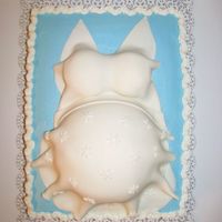 Baby Belly BC icing with Fondant sundress. Belly was cake baked in a round stainless steel bowl I found in my drawer and boobs were cupcakes. This...