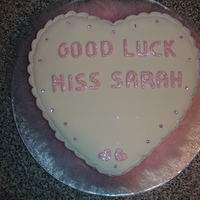 Good Luck Heart shaped sponge cake. Covered in sugarpaste and decorated with sparkly hearts, diamantes and a feather boa.