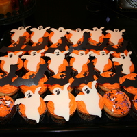 Halloween Cupcakes Chocolate and vanilla cupcakes decorated with orange buttercream. The bats and ghosts are made from candy melts.