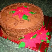 Poinsetta Cake Homemade chocolate icing with fondant poinsettas.