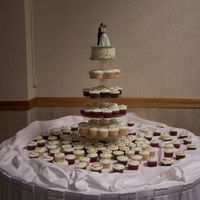 My First Cupcake Wedding! White, chocolate, & red velvet cupcakes. White were decorated with "wedding words"; red velvet had the couple's initials...