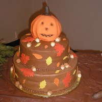 Happy Jack-O-Lantern 14 in round bottom, 10 in round middle, and 6 in ball for the pumpkin. 10 inch tier is vanilla, others are chocolate with chocolate...