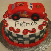 Lightning Mcqueen Lightning McQueen cake made for a 2 year old's birthday. LM is made from Rice Krispies squares and covered in fondant, decals are...