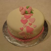 Hearts And Roses Sour cream cake with buttercream filling and MMF. MMF ribbon roses and hearts. Thanks for looking!