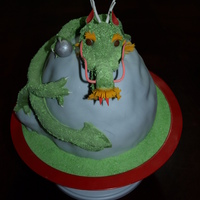 Chinese Dragon The mountain is yellow cake covered in BC and then fondant. The dragon is fondant with gumpaste highlights. The crystal is fondant covered...