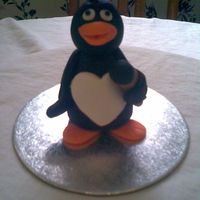 Fondant Pengin I made this for my Daughter'a friend who collects penguin keepsakes. First time making a penguin. Made with fondant and cmc added. A...