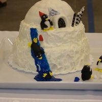 Penguin Party Stacked WASC with Buttercream Dream icing for daughters b-day. Igloo covered in fondant, all penguins are fondant. Water slide is icing gel...