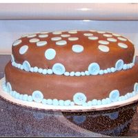 Blue Polka Dots WASC cake covered in chocolate mmf with blue fondant accents. The blue fondant was store bought but everything else made from recipes off...